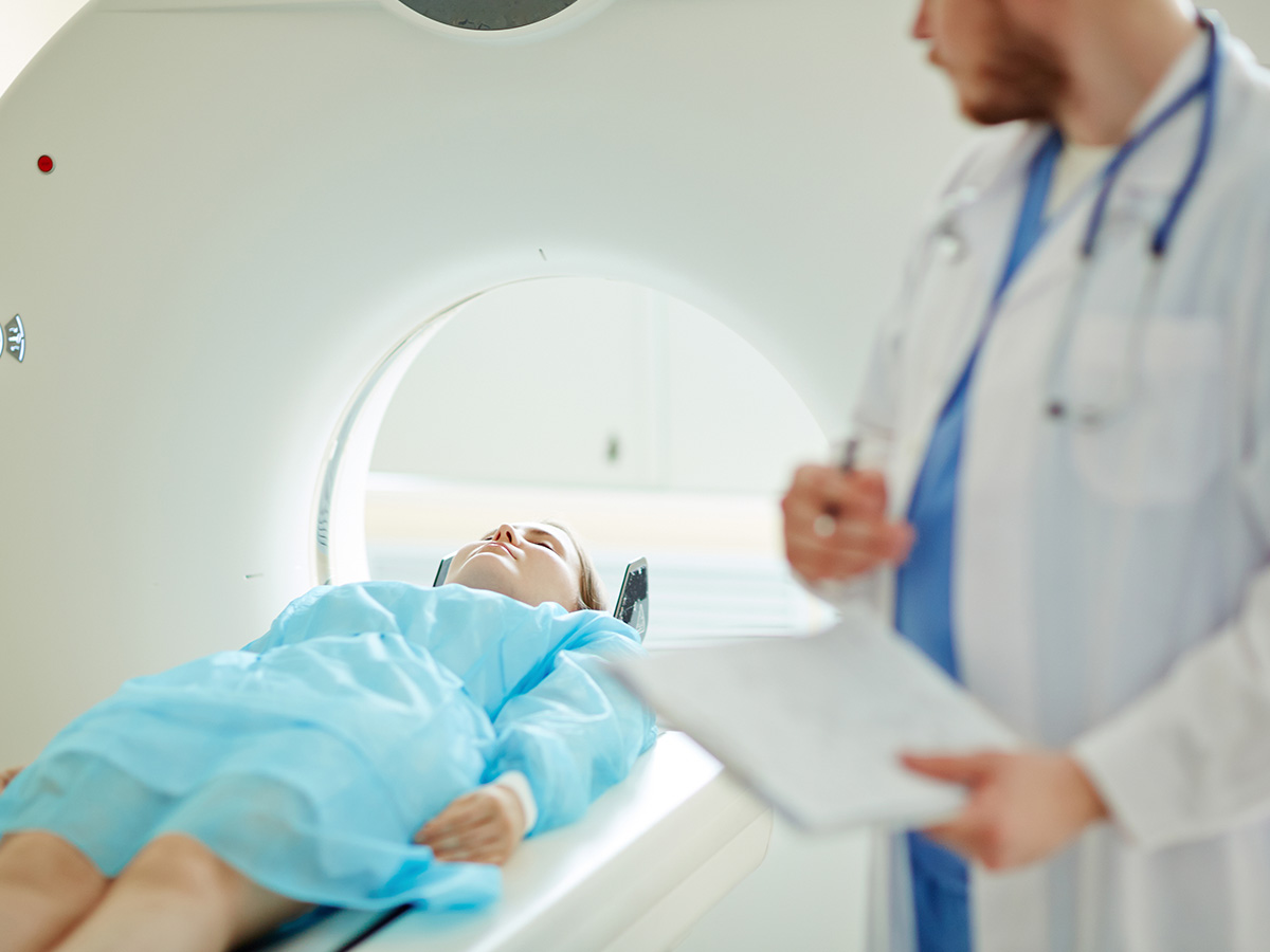 1200x900GMB-4 Doctor examining a female patient with CT scanner.
