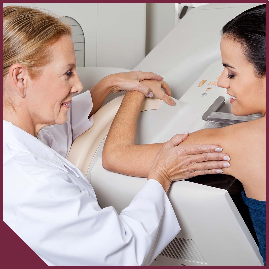 Image-3 Mature female doctor assisting young patient during mammography.