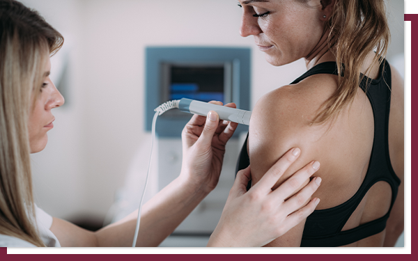 What Do They Look For in a Breast Ultrasound - IMG 1 A young woman receives an ultrasound on her breast.