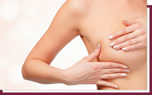 What Do They Look For in a Breast Ultrasound - IMG 4 Woman checks her breast implant for signs of leaks or problems.
