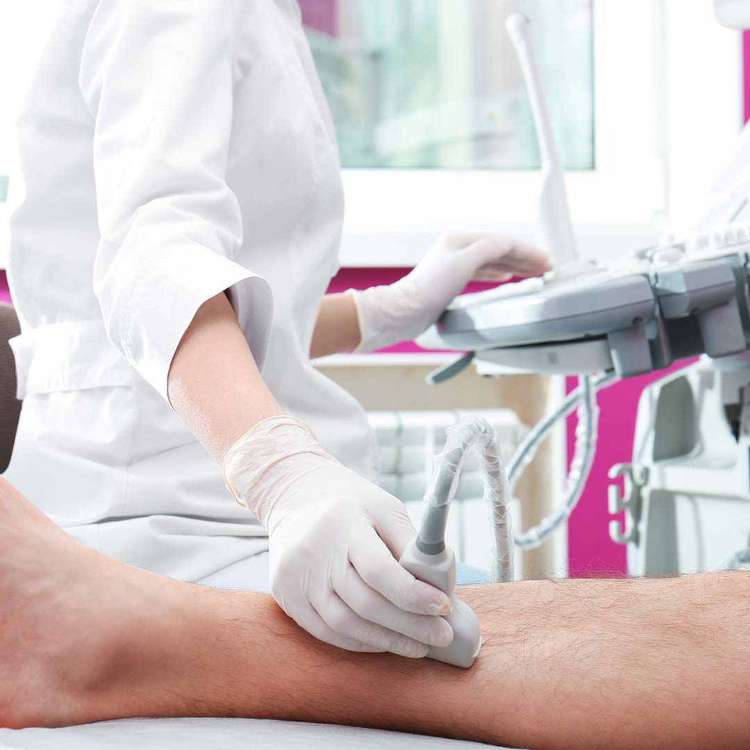 1080x1080Social-2 Doctor conducting ultrasound examination of patient`s leg in clinic
