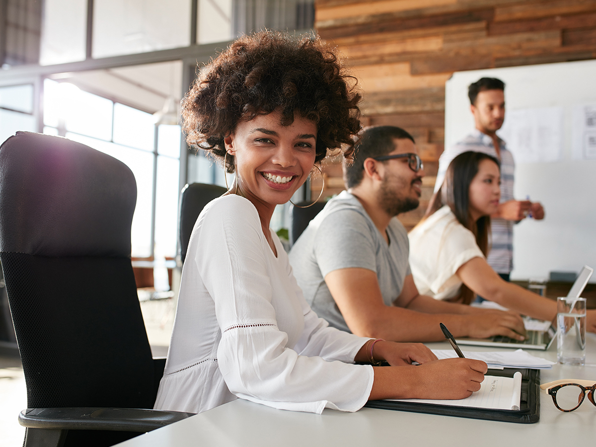 1200x900GMB-2 happy woman at a business meeting desk